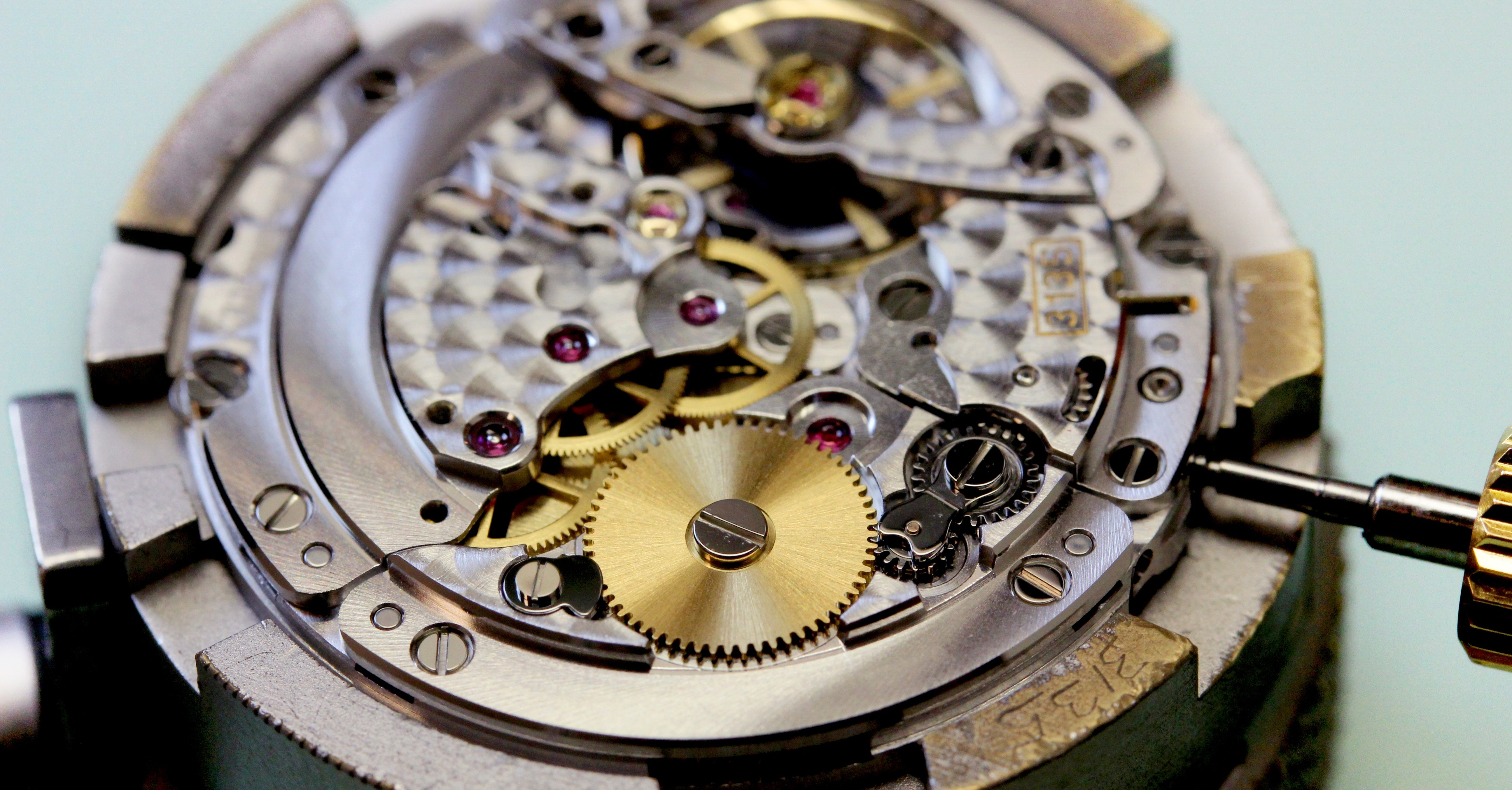 Precision watchmaking tools arranged for detailed timepiece repair